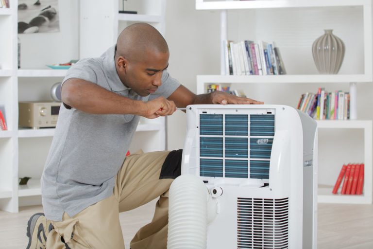 guy installing a air conditioner 